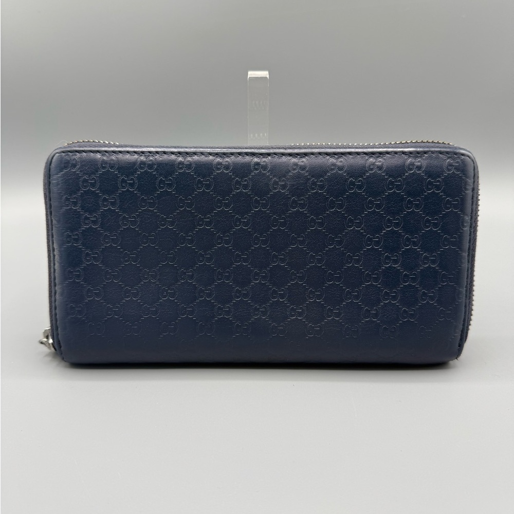 Authentic Gucci Dark Blue GG Imprint Leather Zip Around
